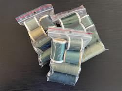 5 ruller sy/quiltetråd i samme farveskala lykkepose. Grøn